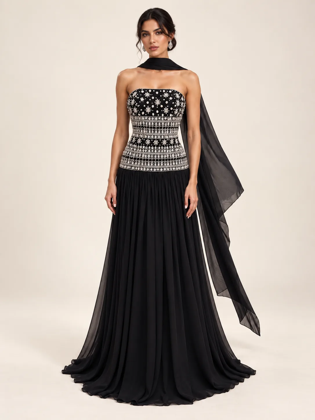Black strapless gown with silver embellished bodice and flowing scarf
