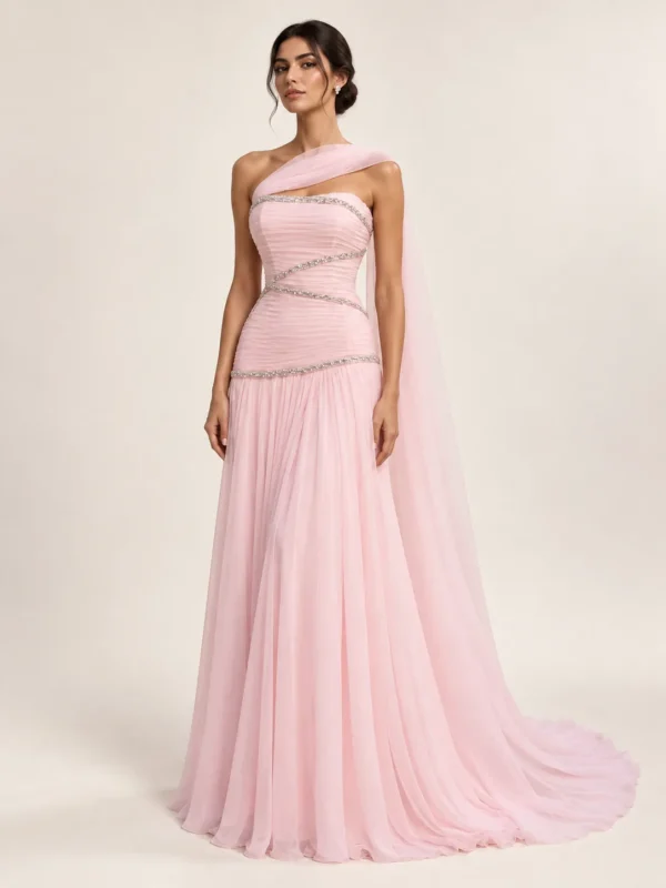 Rose ruched gown with curved silver embellishment and flowing scarf