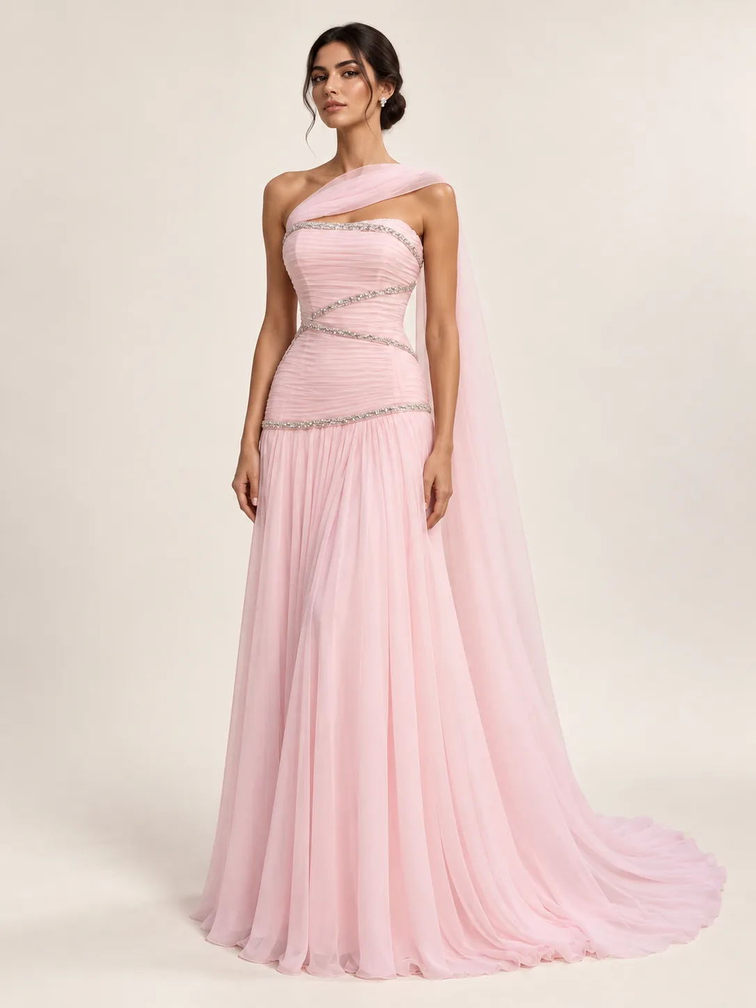 Rose ruched gown with curved silver embellishment and flowing scarf